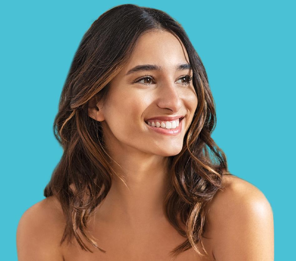 Brown haired girl smiling and looking off to the side | Ethereal Aesthetics