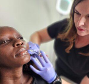 woman receiving lip filler treatment