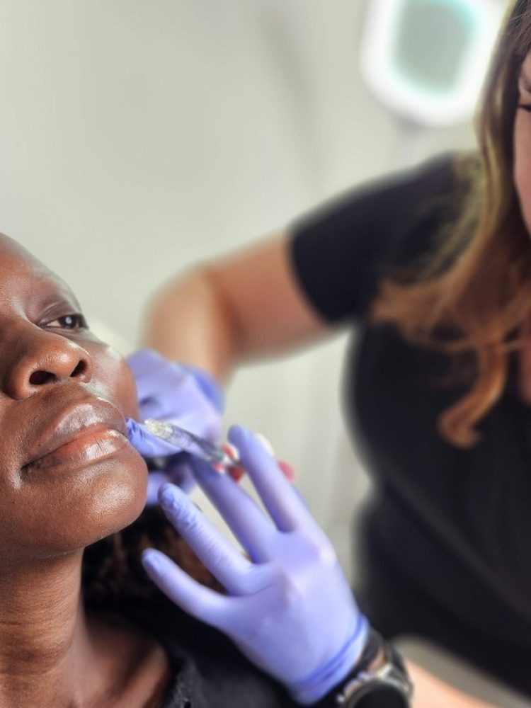 woman receiving lip filler treatment